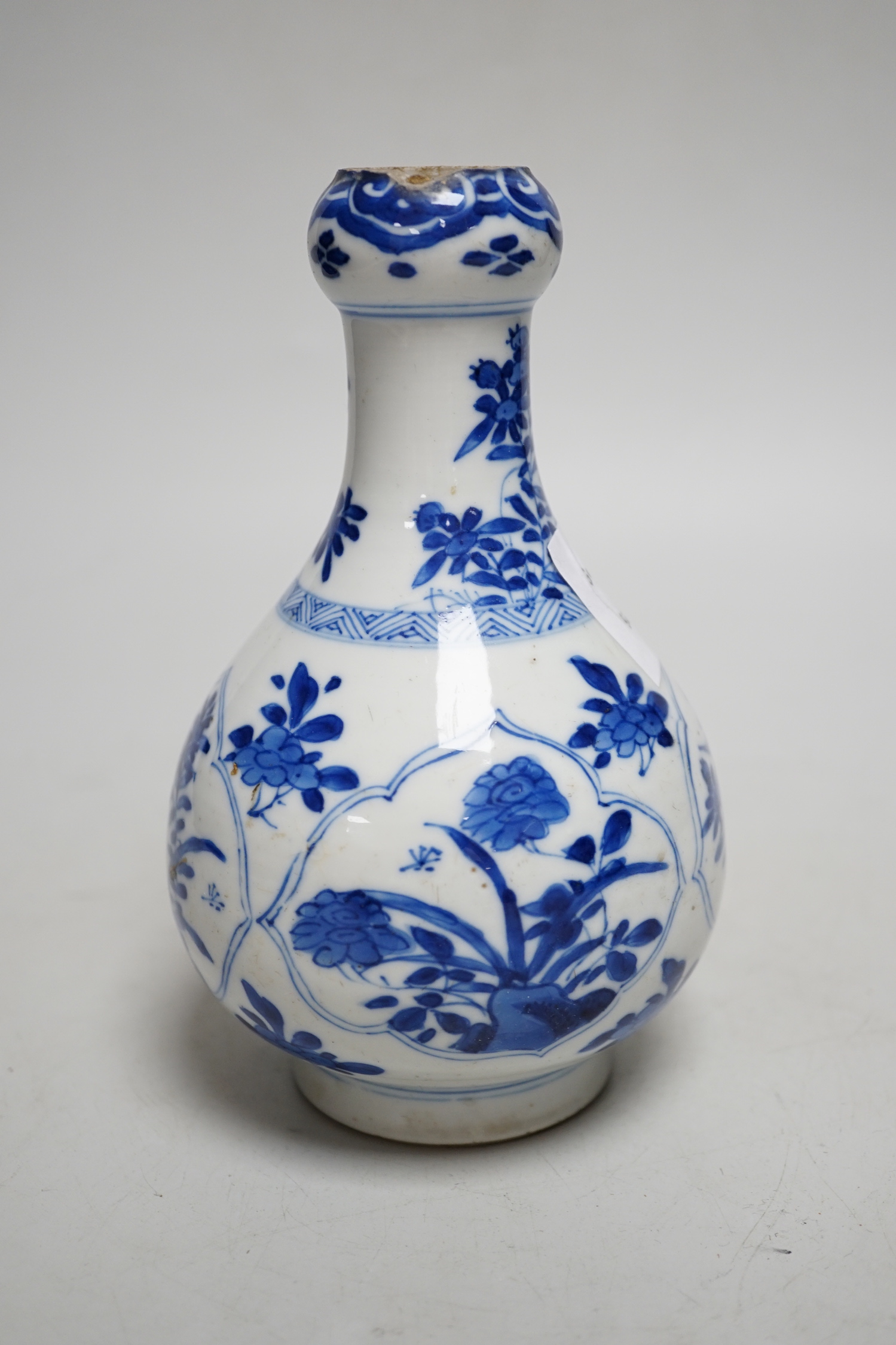 A Chinese blue and white garlic neck bottle, Kangxi period, 16cm, neck cut down